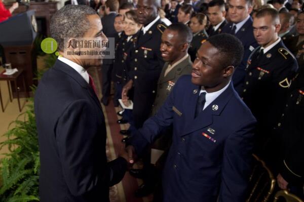 FILE - President Barack Obama greets service members after they became U.S. citizens during a naturalization ceremony in the East Room of the White House in Washington, July 4, 2012. (AP Photo/Evan Vucci, File)