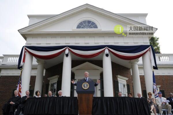 FILE - President George W. Bush gestures during remarks at Monticello's 46th annual Independence Day celebration and naturalization ceremony in Charlottesville, Va., July 4, 2008. (AP Photo/Evan Vucci, File)